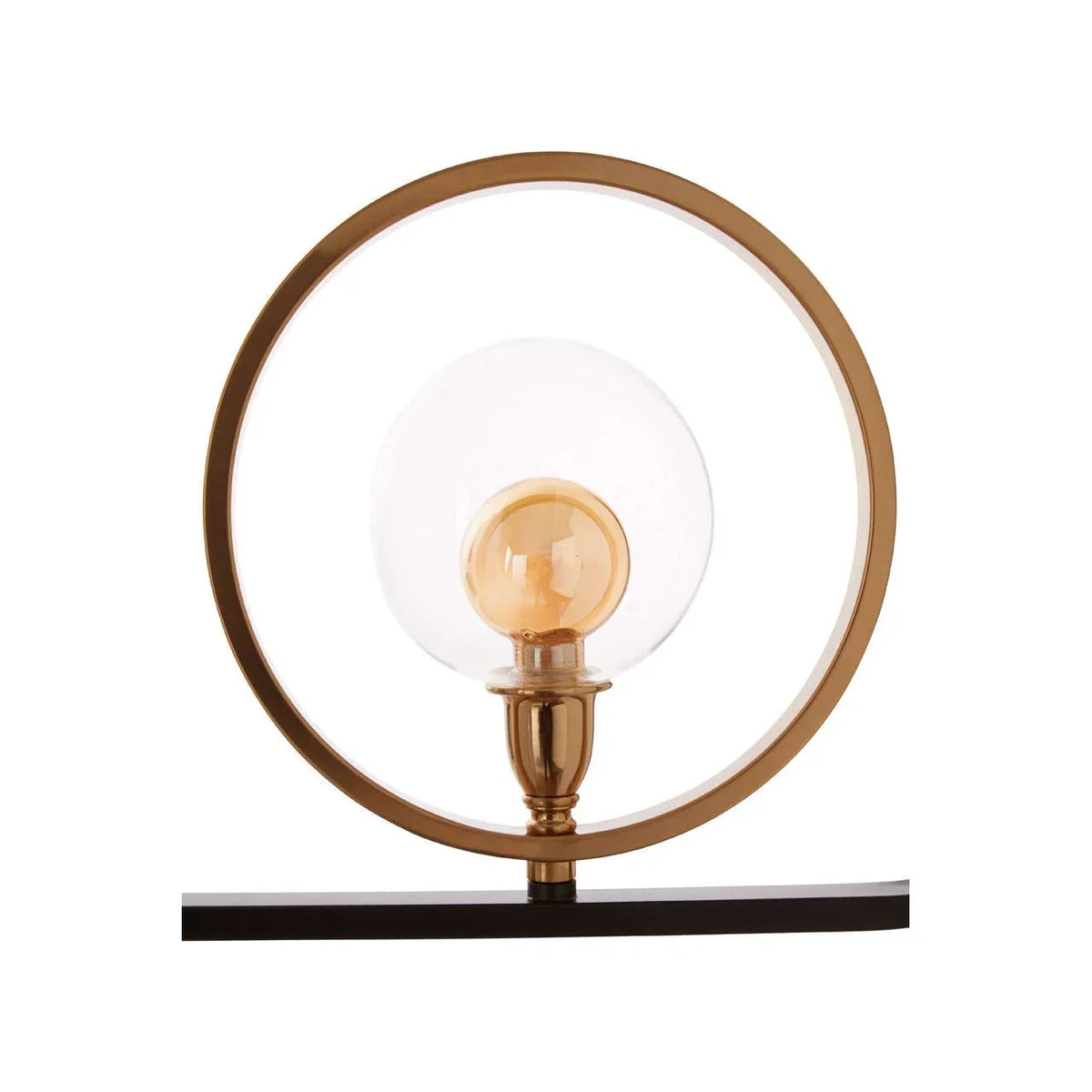 Gold table lamp with circular frame and glass globe shade on black base