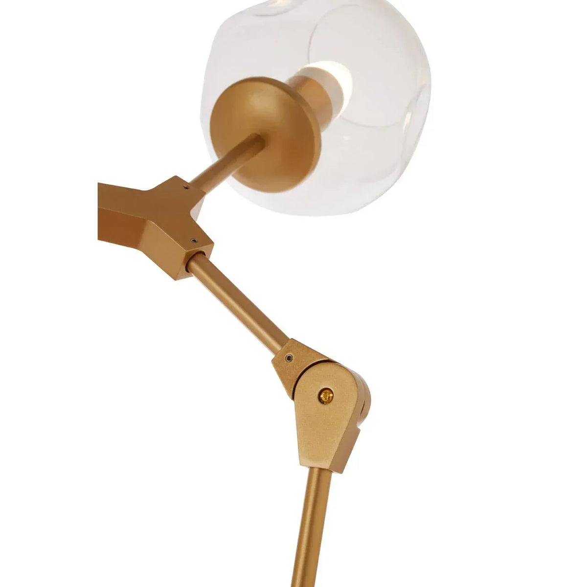 Gold adjustable floor lamp with clear glass shade and visible joint detail