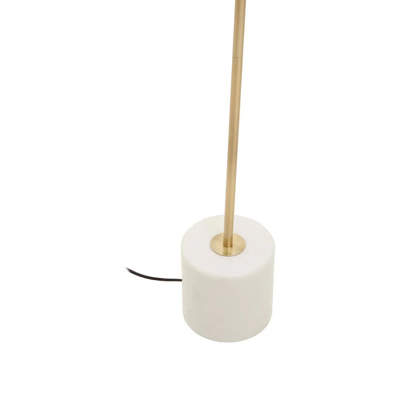 Brass floor lamp with a round marble base and visible black cord
