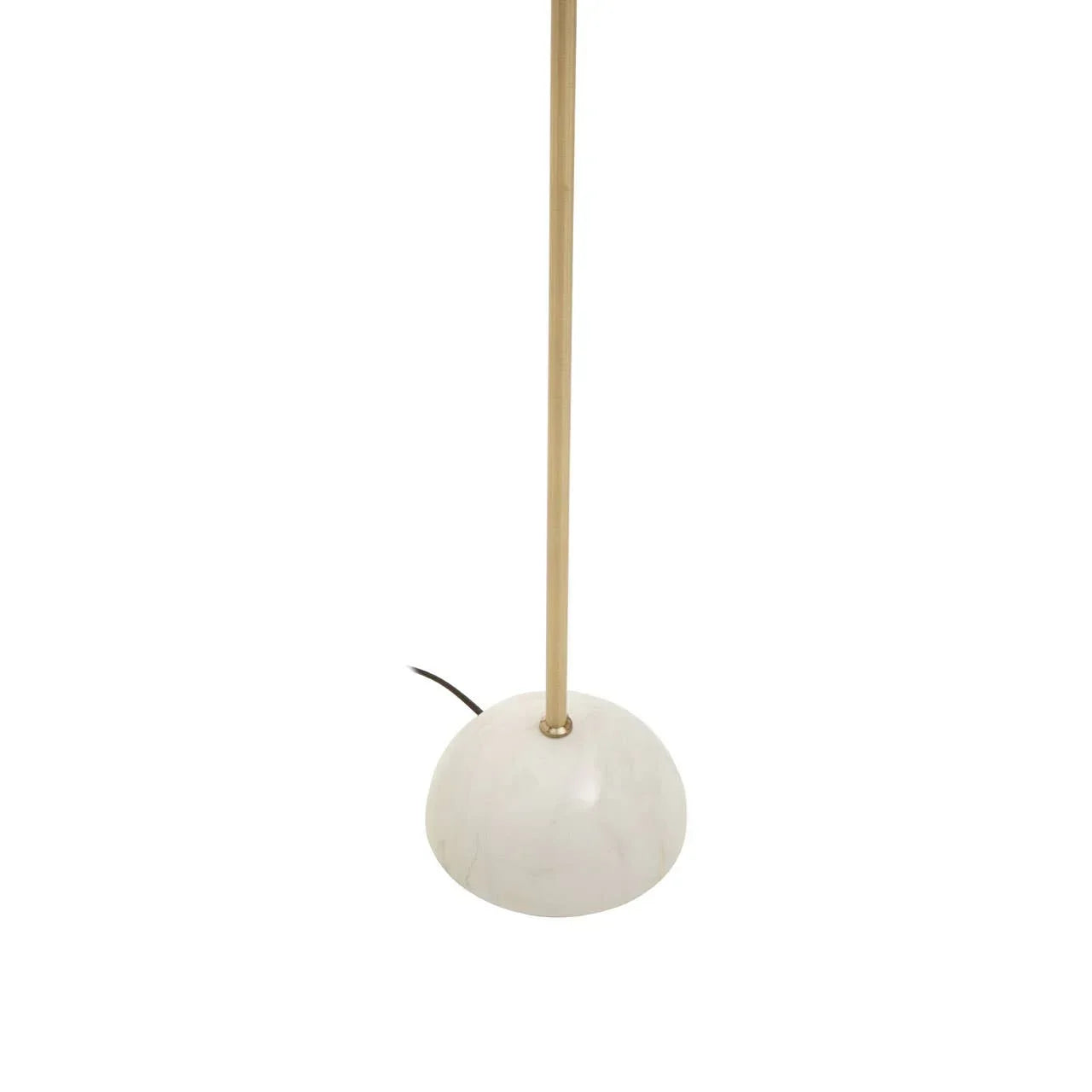 Brass floor lamp with white marble base and visible black cord on white background