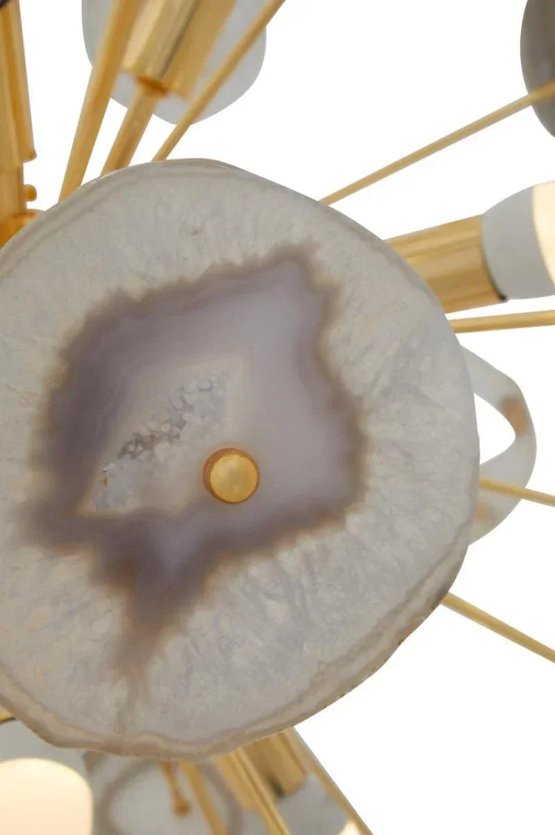 Close-up of agate stone detail on gold metal chandelier lighting fixture
