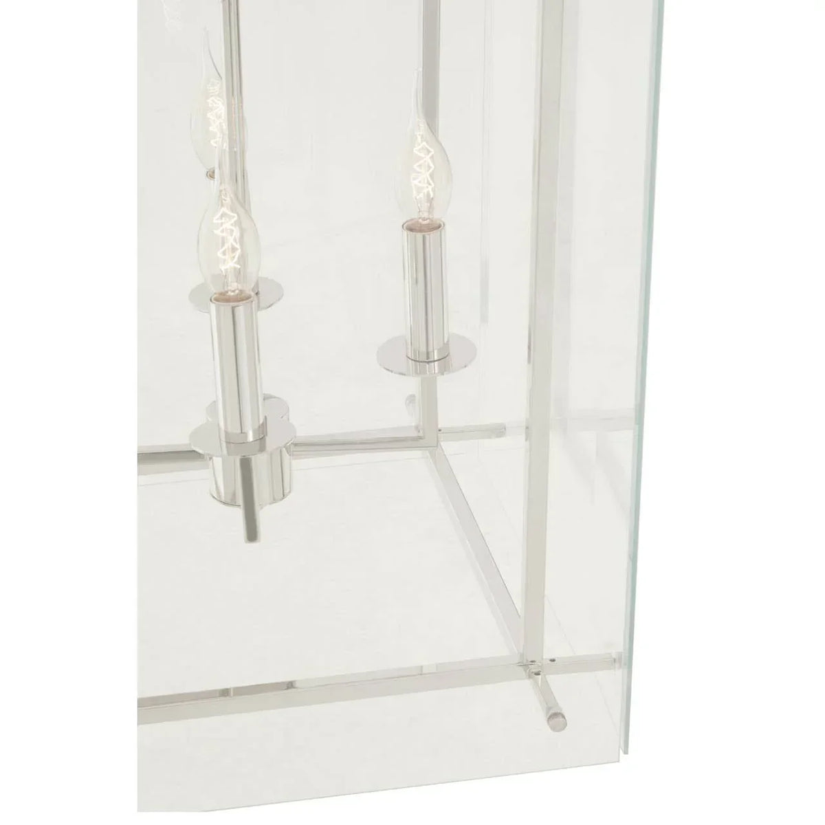Close view of chrome candle-style lamp base with glass frame for home lighting