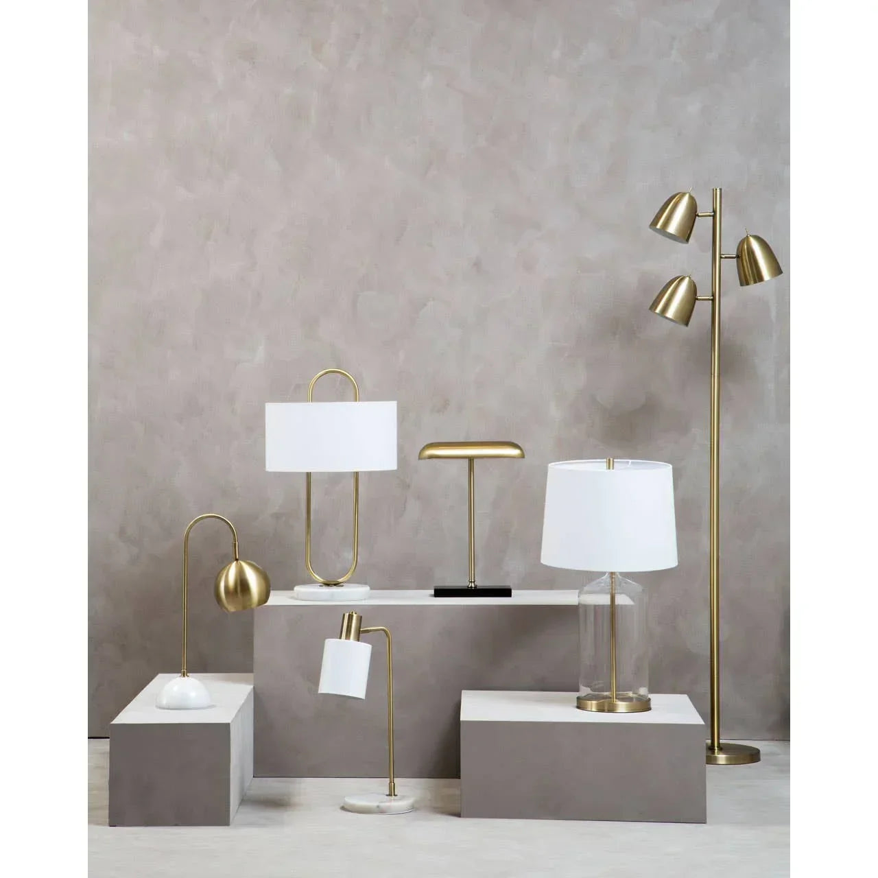 Modern gold and white table lamps and floor lamp with marble and glass details