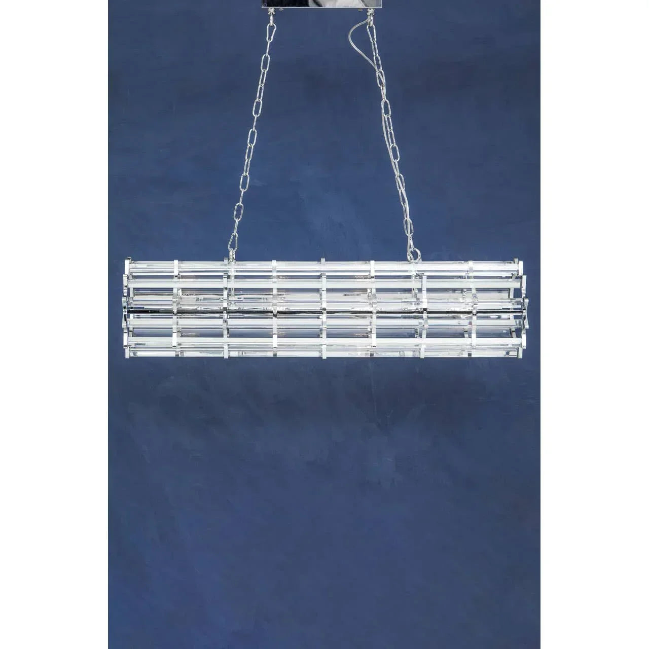 Modern chrome pendant light with rectangular crystal bars hanging from ceiling chain