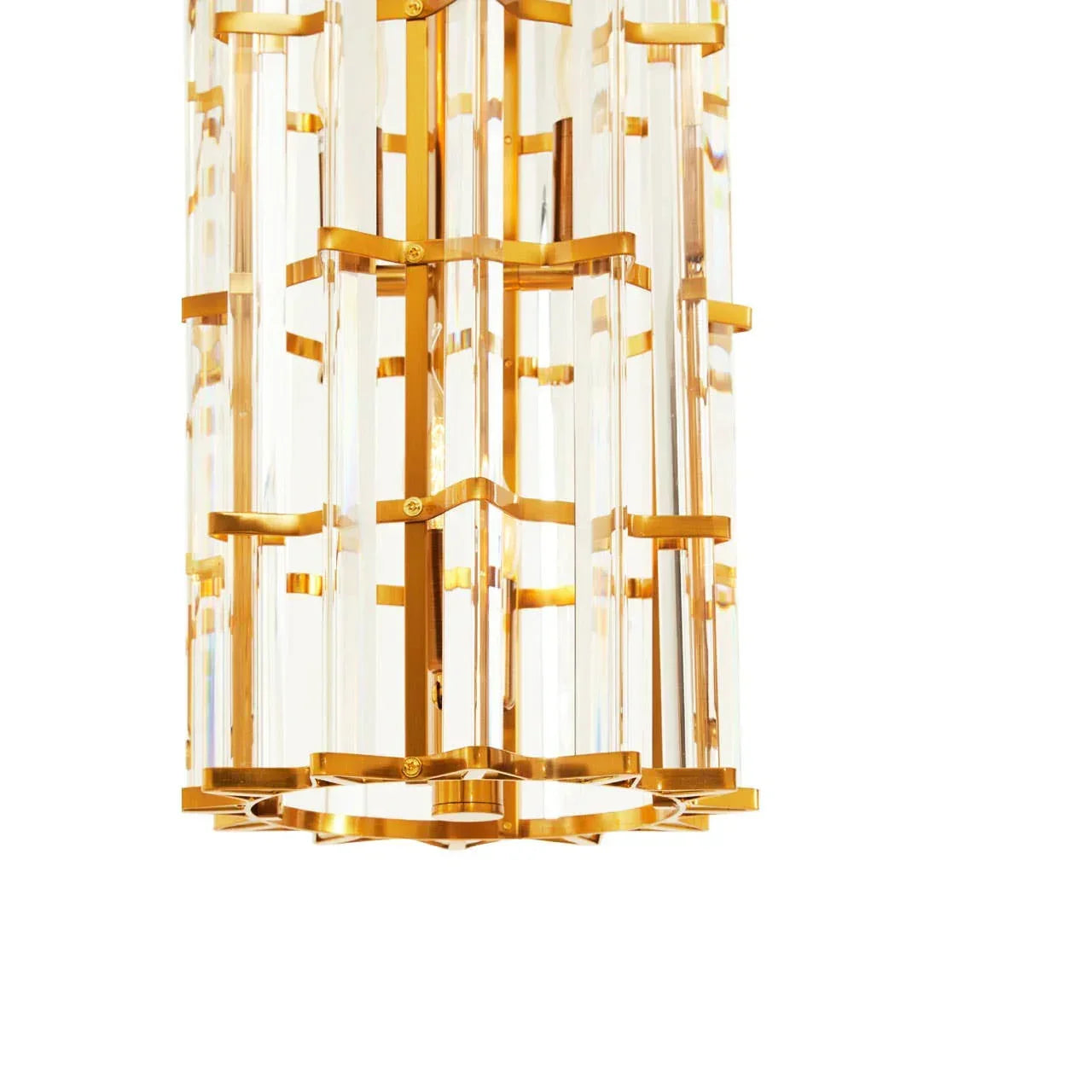 Gold and crystal chandelier with vertical geometric bars, close-up on modern pendant light
