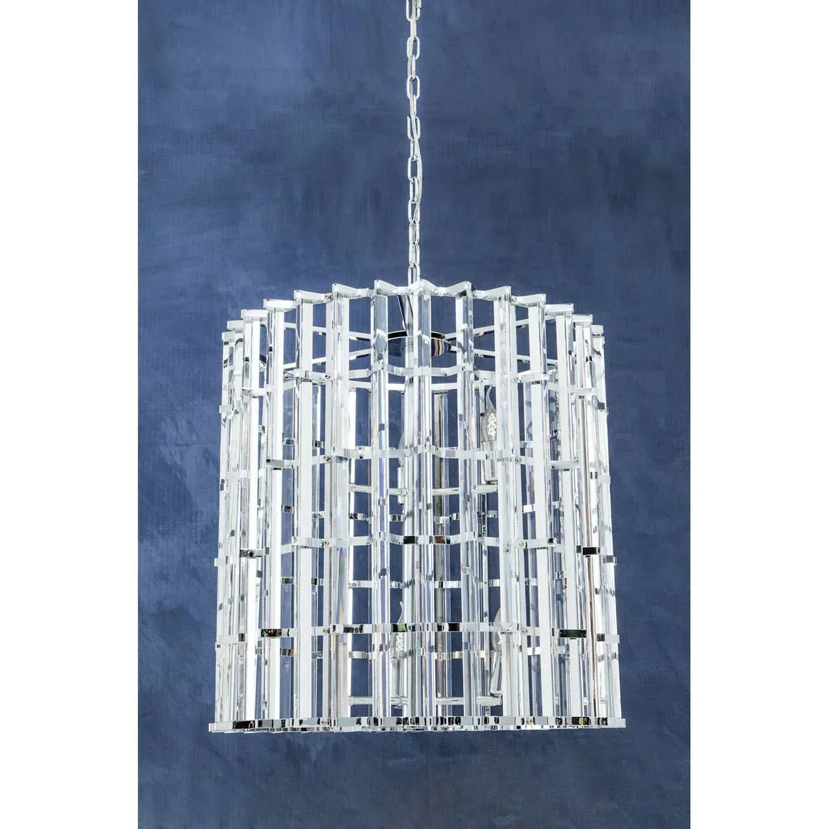 Modern crystal chandelier with silver metal frame and geometric design, suspended by chain