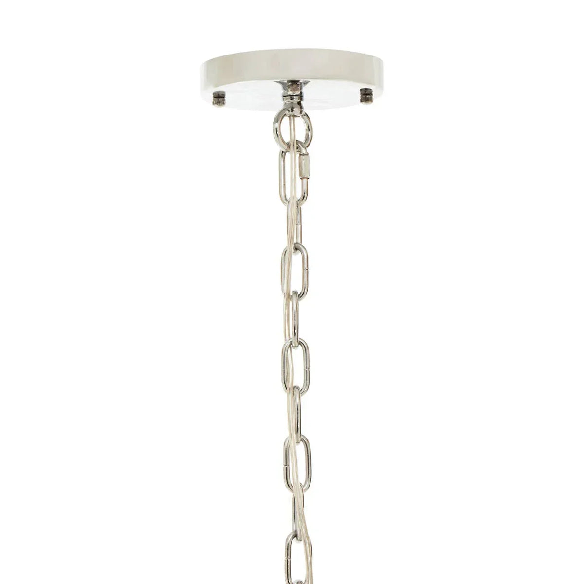 Chrome ceiling light chain with round ceiling rose, close-up view