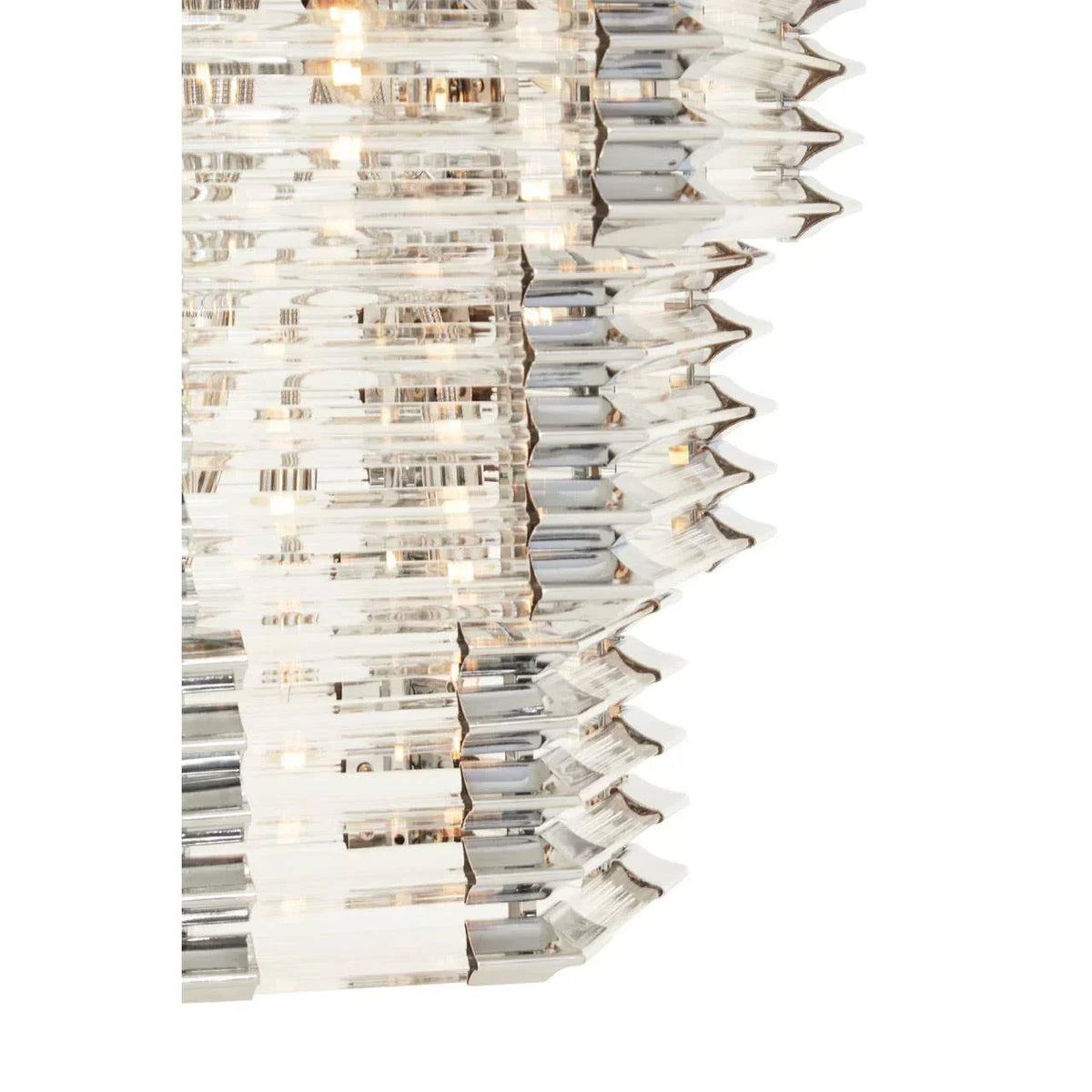 Close-up of crystal chandelier tiers with angled glass prisms and warm lighting