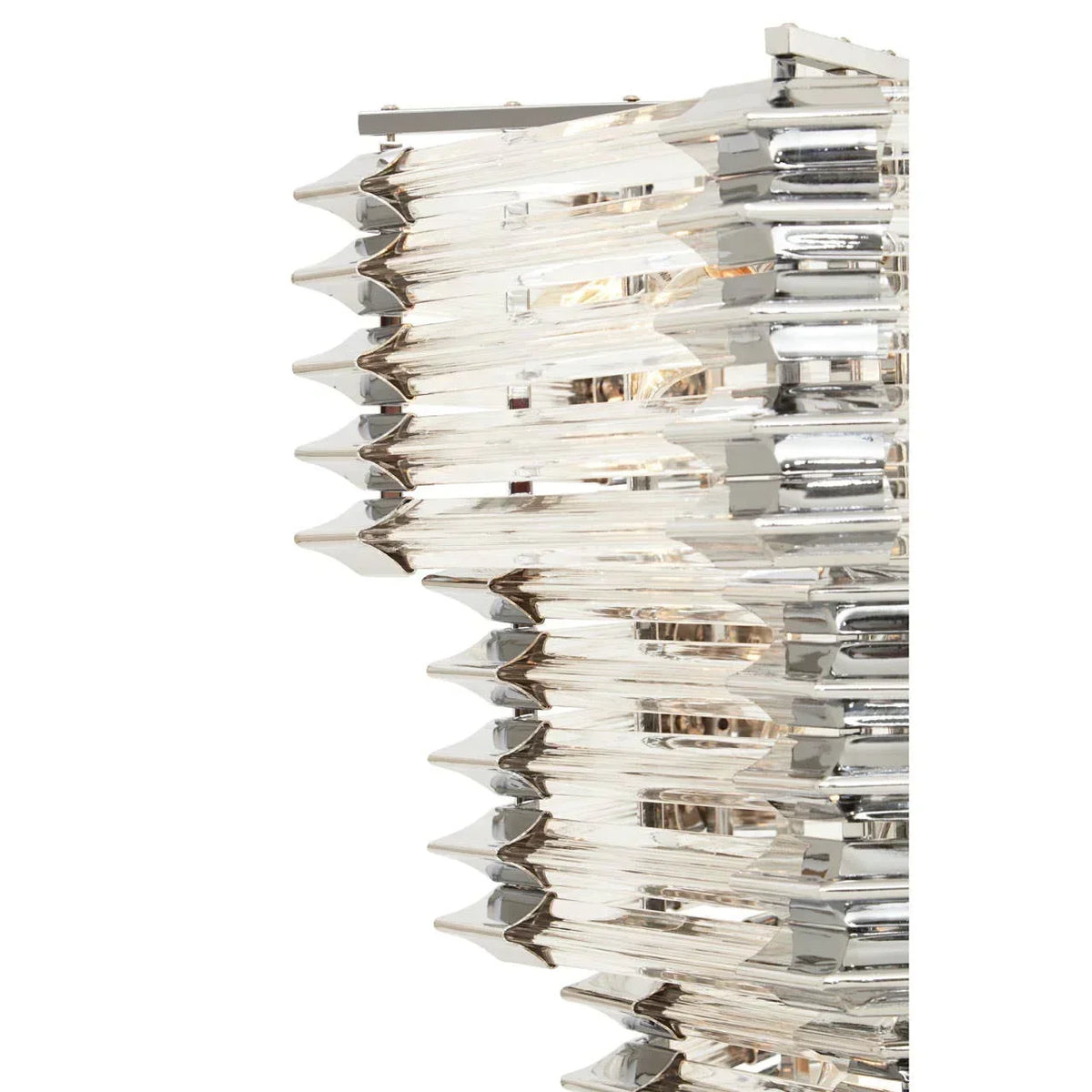 Close-up of modern crystal wall light with layered glass rods and chrome finish