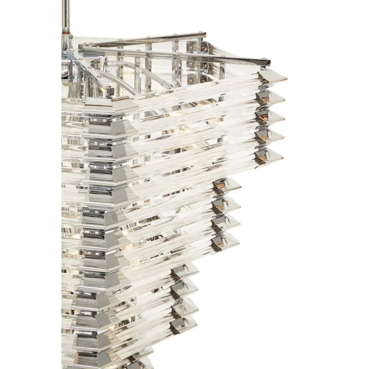 Close-up of modern crystal chandelier with tiered rectangular glass panels and chrome frame