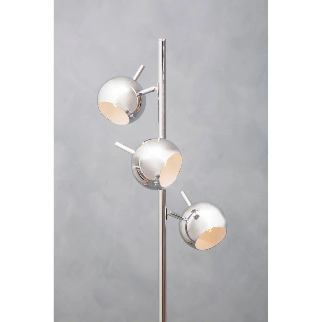 chrome floor lamp with three adjustable spherical lights on vertical pole