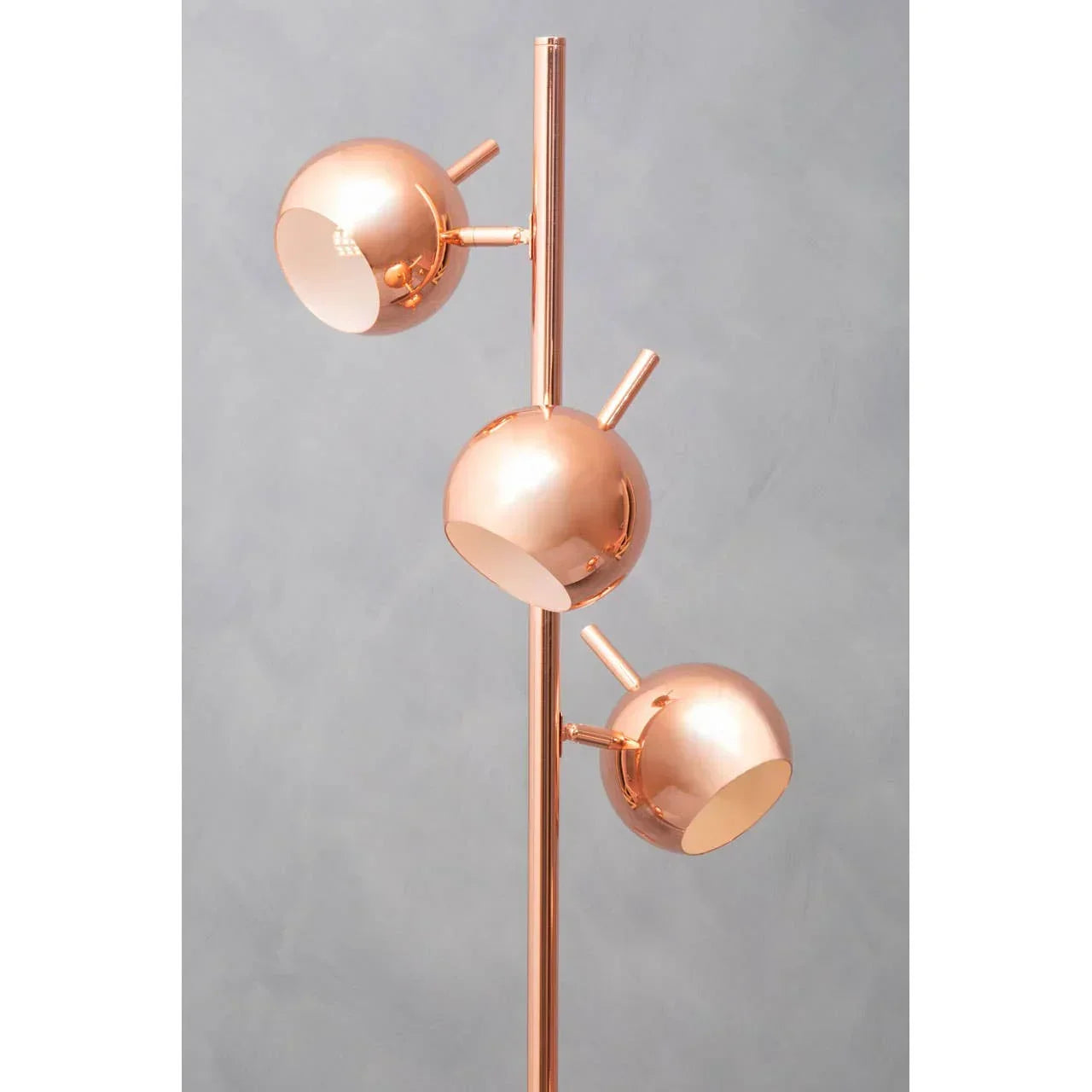 Copper floor lamp with three adjustable globe lights on a vertical pole