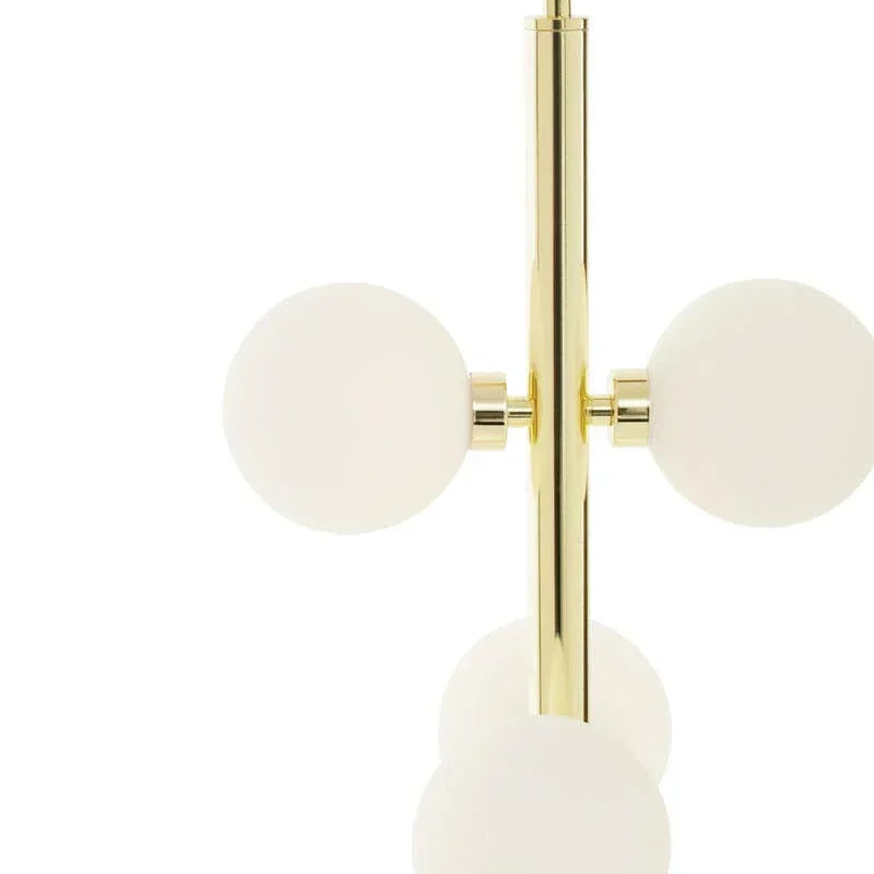 Modern brass floor lamp with white glass globes in vertical arrangement