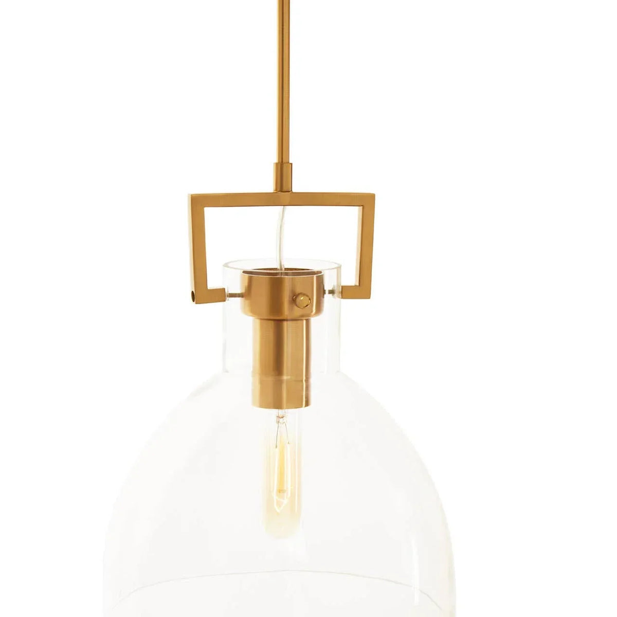 Glass pendant light with gold metal fixture and exposed bulb, close-up view