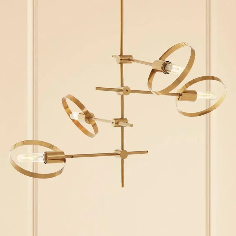 Modern gold metal chandelier with circular frames and exposed bulbs