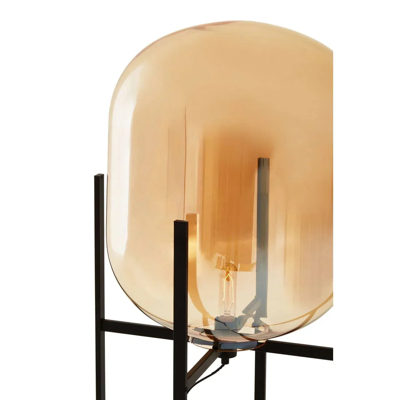 Modern table lamp with amber glass shade and black metal base, close-up view