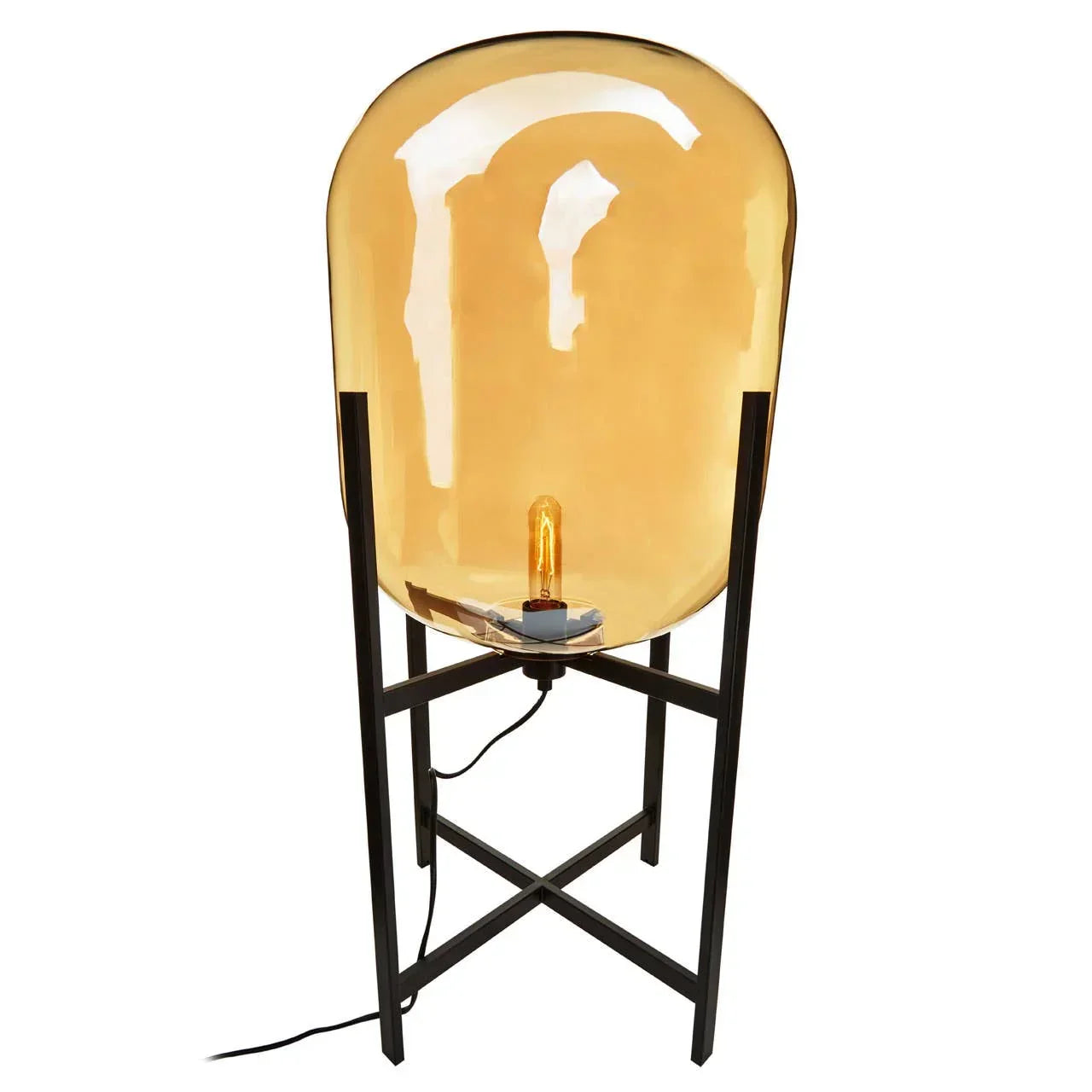Amber glass table lamp with exposed bulb on black metal frame base