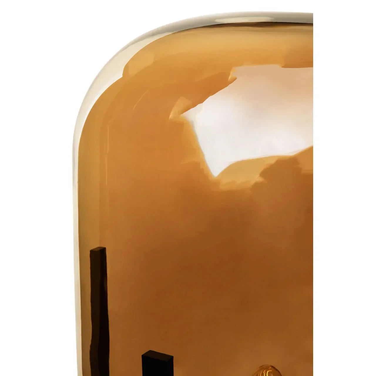 Amber glass decorative lamp close-up showing smooth curved surface
