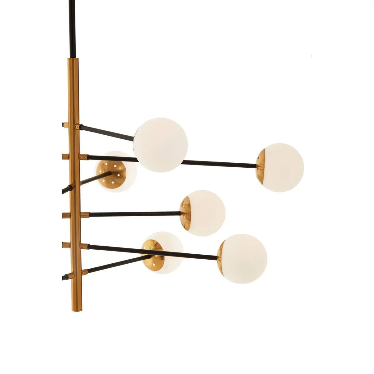 Modern brass chandelier with six frosted glass globe lights and black metal arms