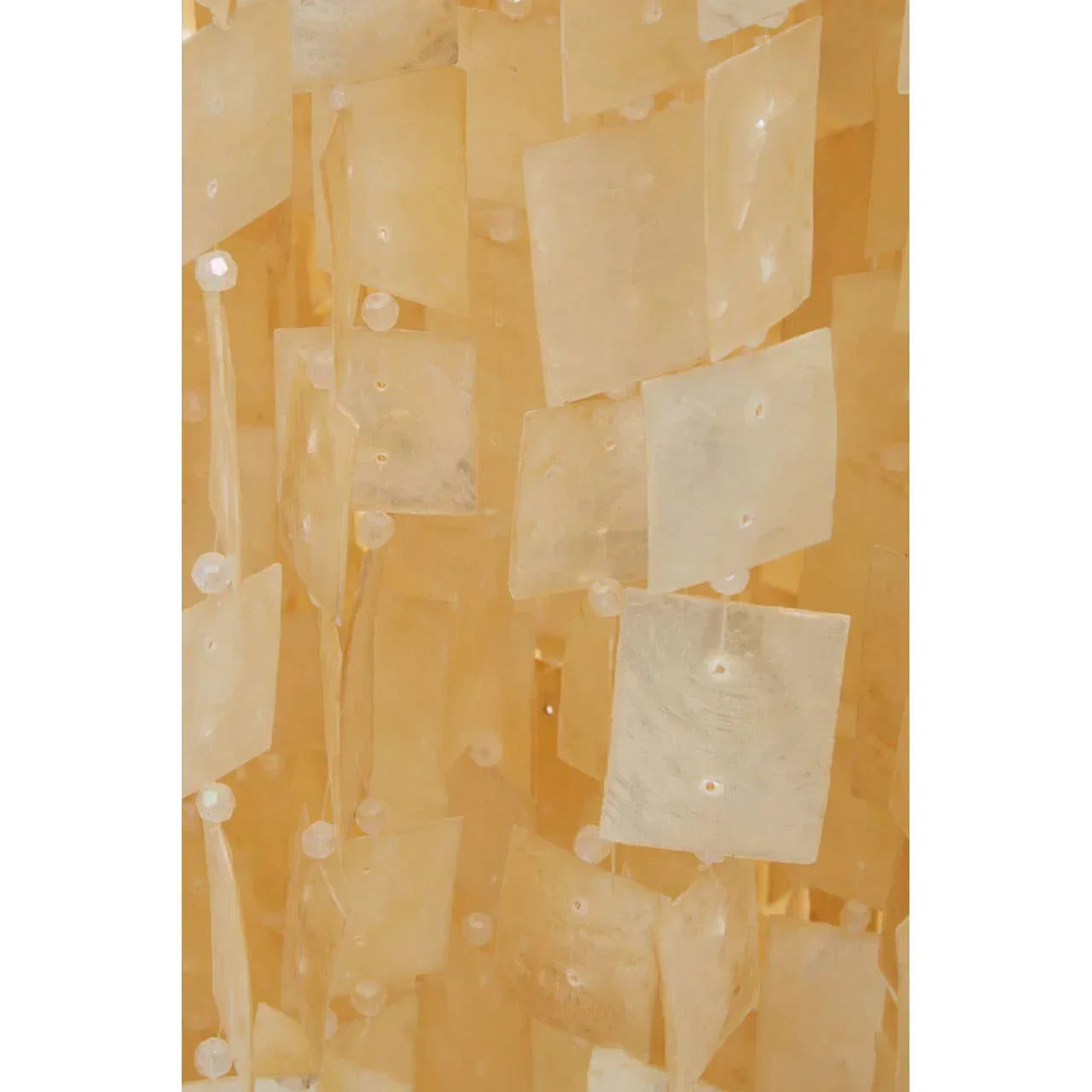 Close-up of capiz shell chandelier panels with translucent square shapes and light beige color