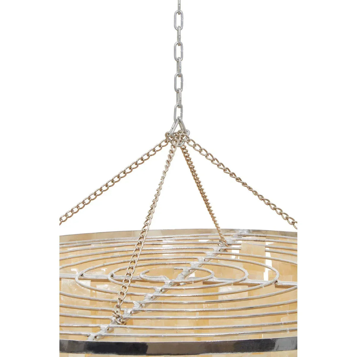 Modern chandelier with metal chains and circular patterned frame in close-up