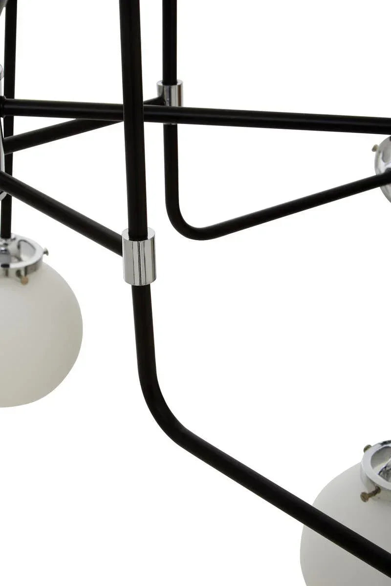 Close view of black metal light fixture frame with white glass globe lamp shades