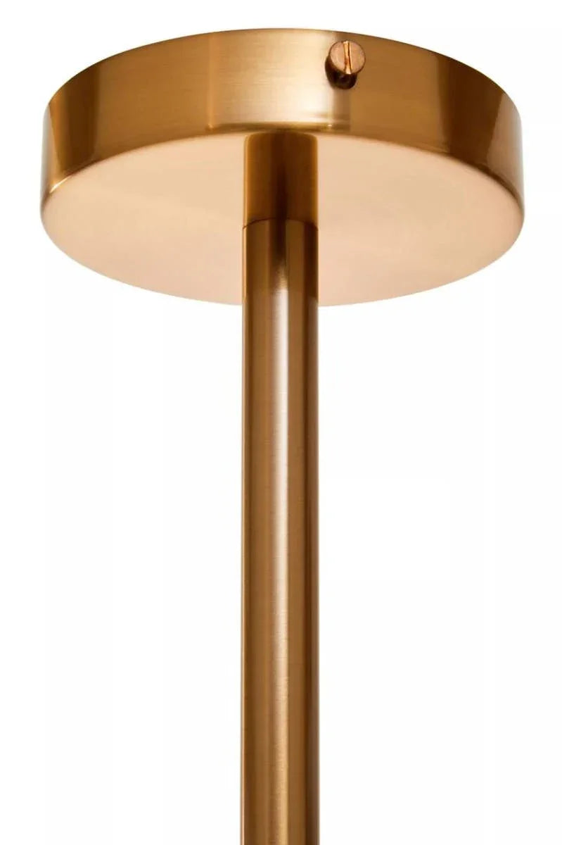 Close-up of gold metal ceiling light fixture with round mount and tubular stem