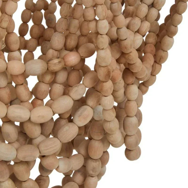 Close-up view of natural wood bead chandelier strands with oval shapes and light finish