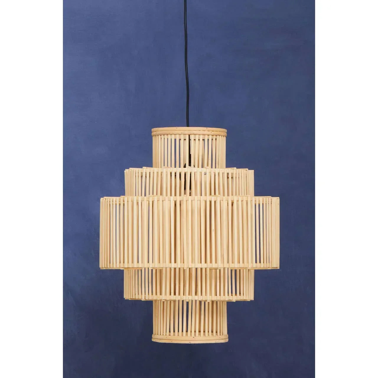Natural bamboo pendant light with tiered geometric design against blue background