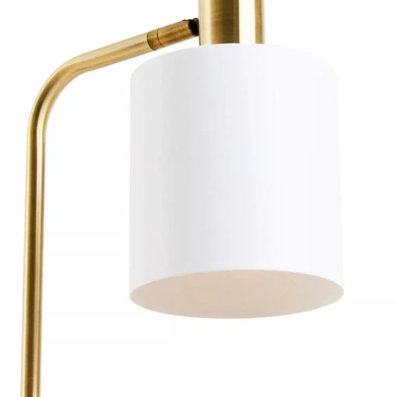 Brass floor lamp with white cylindrical shade, close-up on lamp head and arm