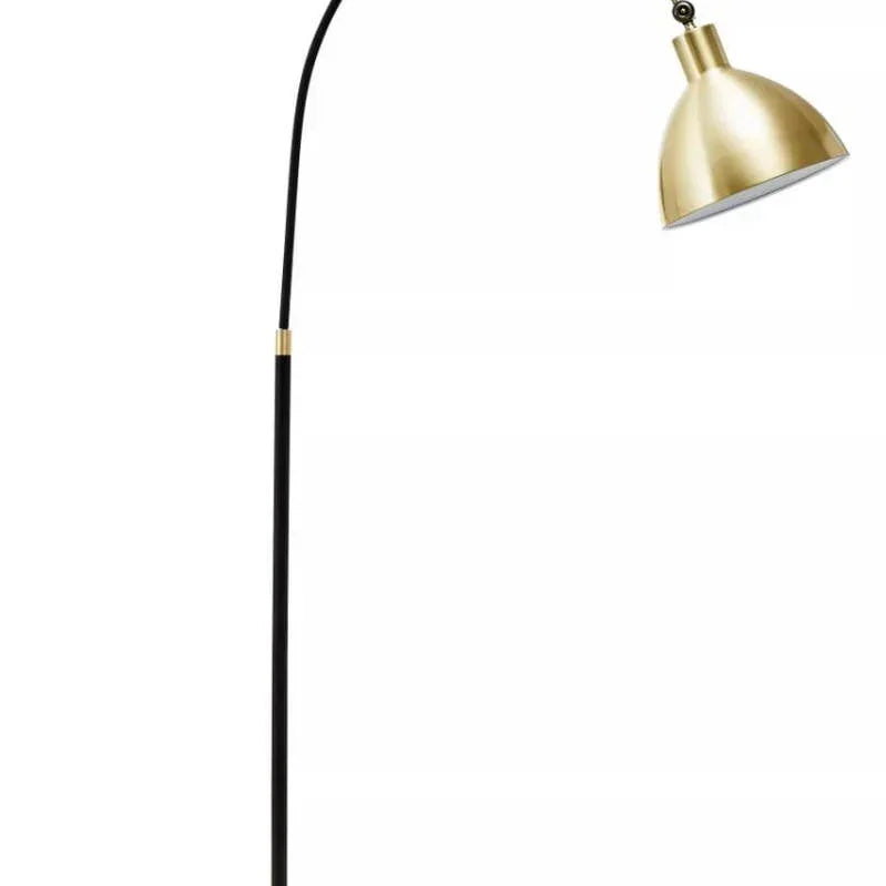 Black arc floor lamp with gold metal shade and round marble base