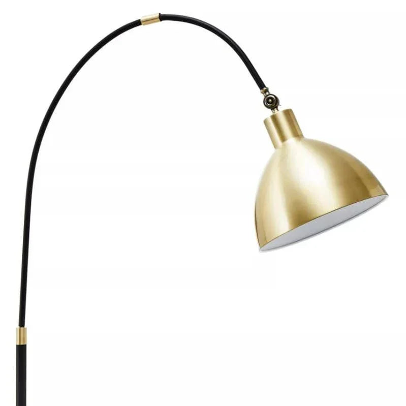 Brass dome floor lamp with black arched stand and adjustable shade
