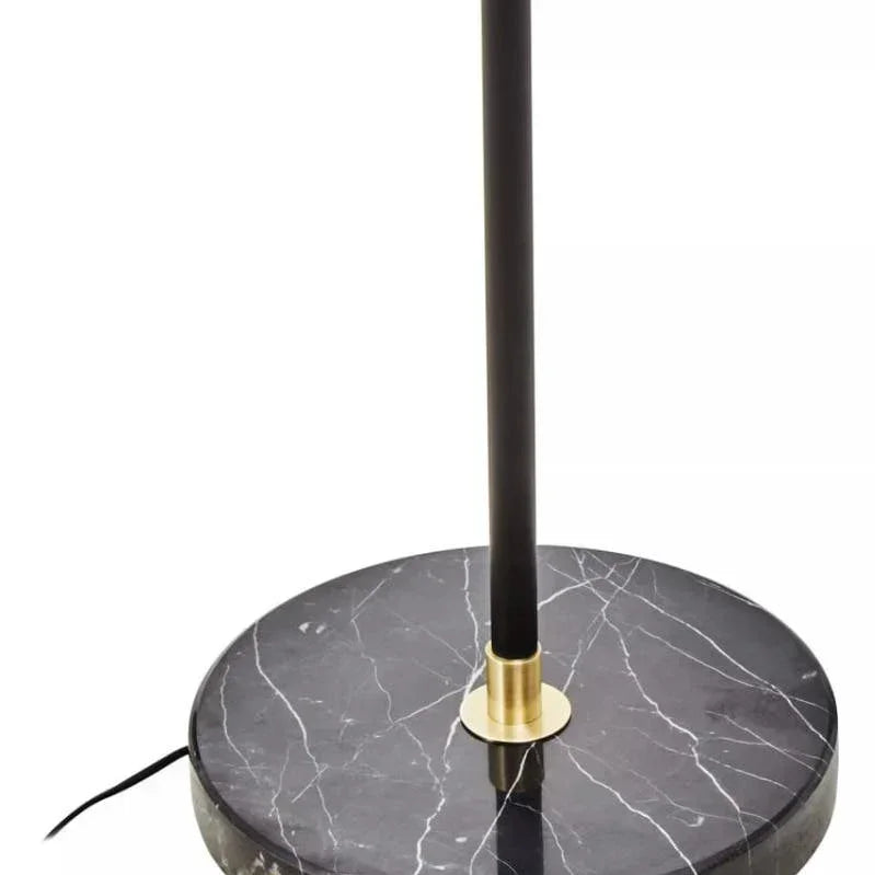 black marble lamp base with gold accent and upright black pole, close-up view