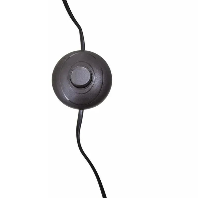 Black lamp foot switch with round button and cable against white background