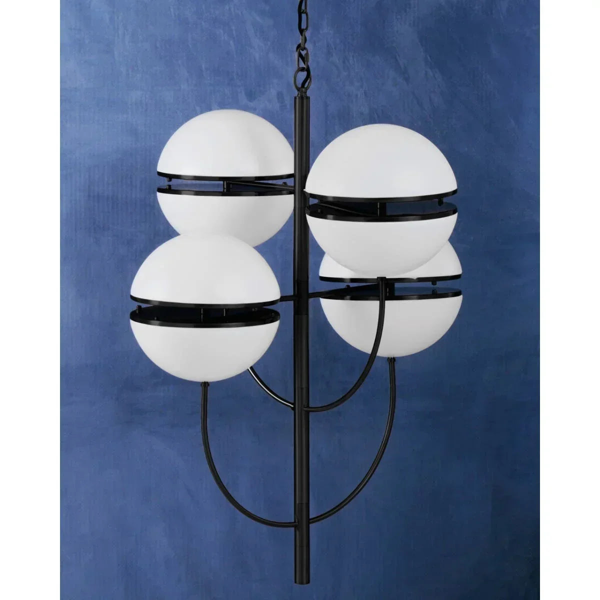 Modern black metal chandelier with six white globe lights against blue wall background