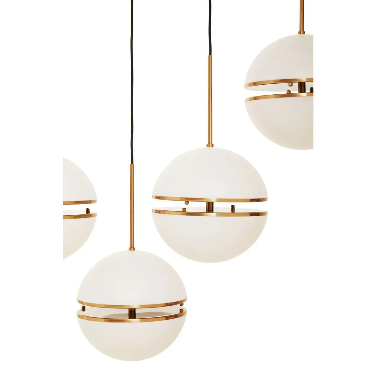 Modern globe pendant lights with gold accents and frosted glass shades, close-up view