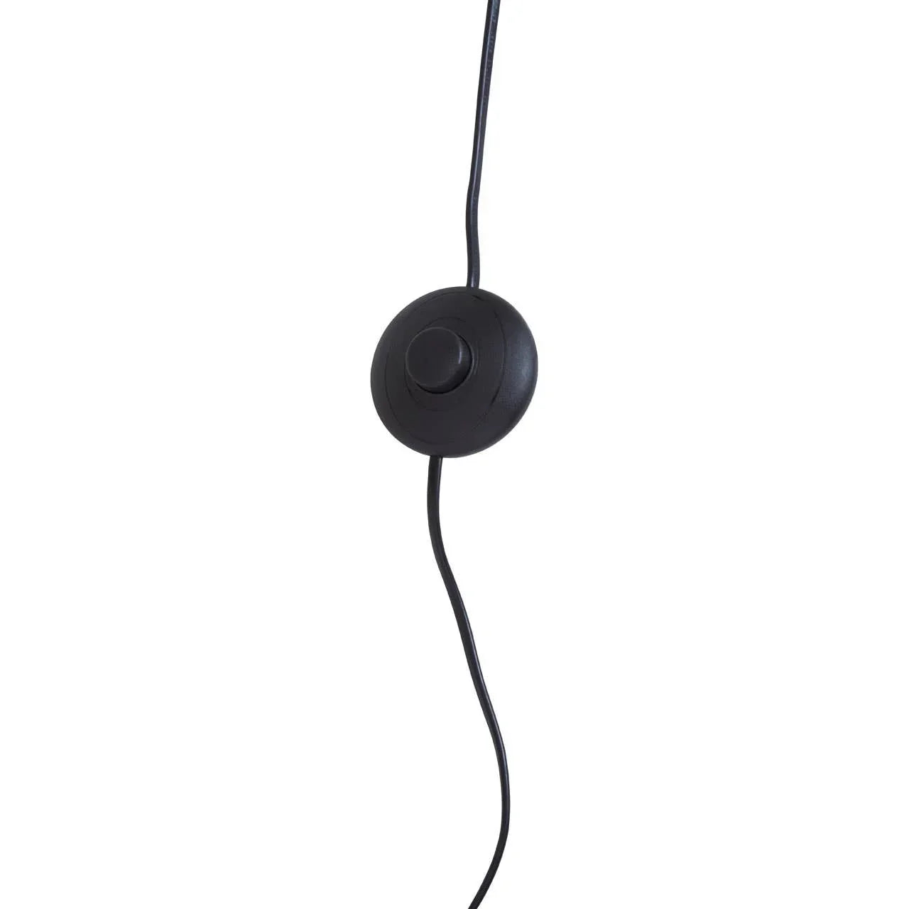 Black floor lamp foot switch with round button and cable against white background