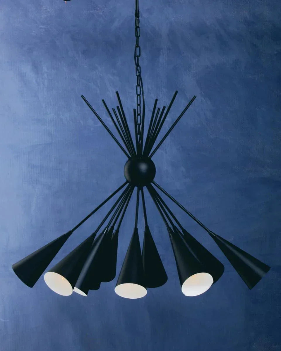Black modern chandelier with multiple conical shades against textured blue wall