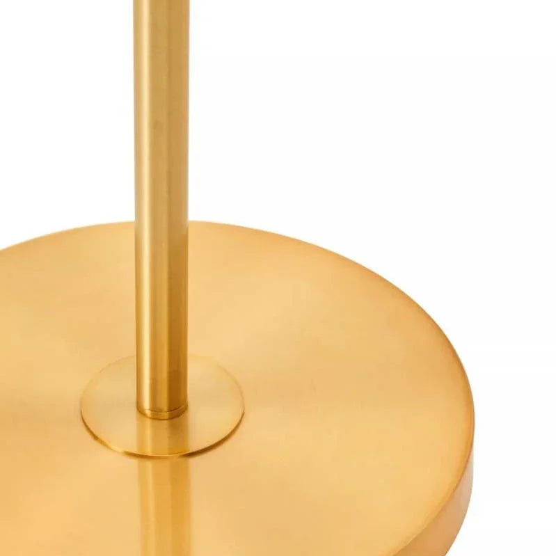 Round gold metal lamp base with a slim stand, close-up view on white background