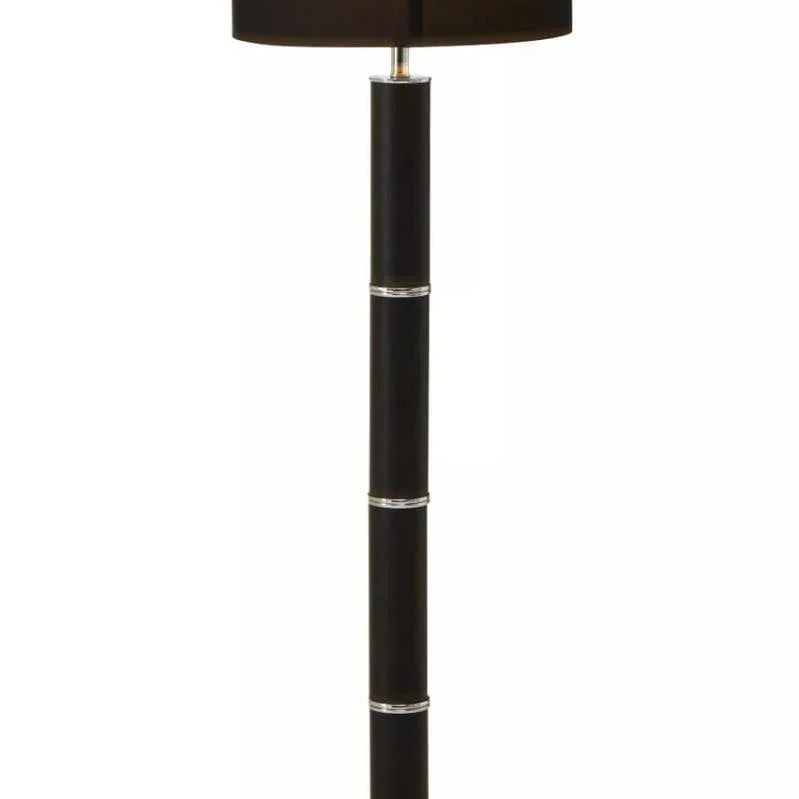 Modern black floor lamp with cylindrical base and chrome accents