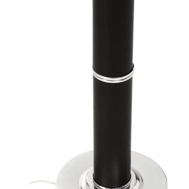 Black floor lamp base with chrome trim and visible power cable