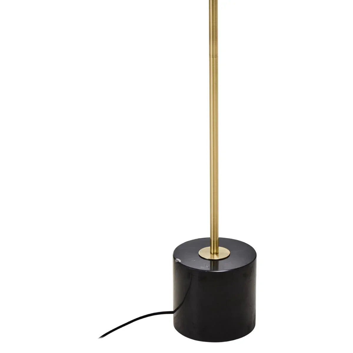Brass floor lamp with black cylindrical marble base and visible power cord