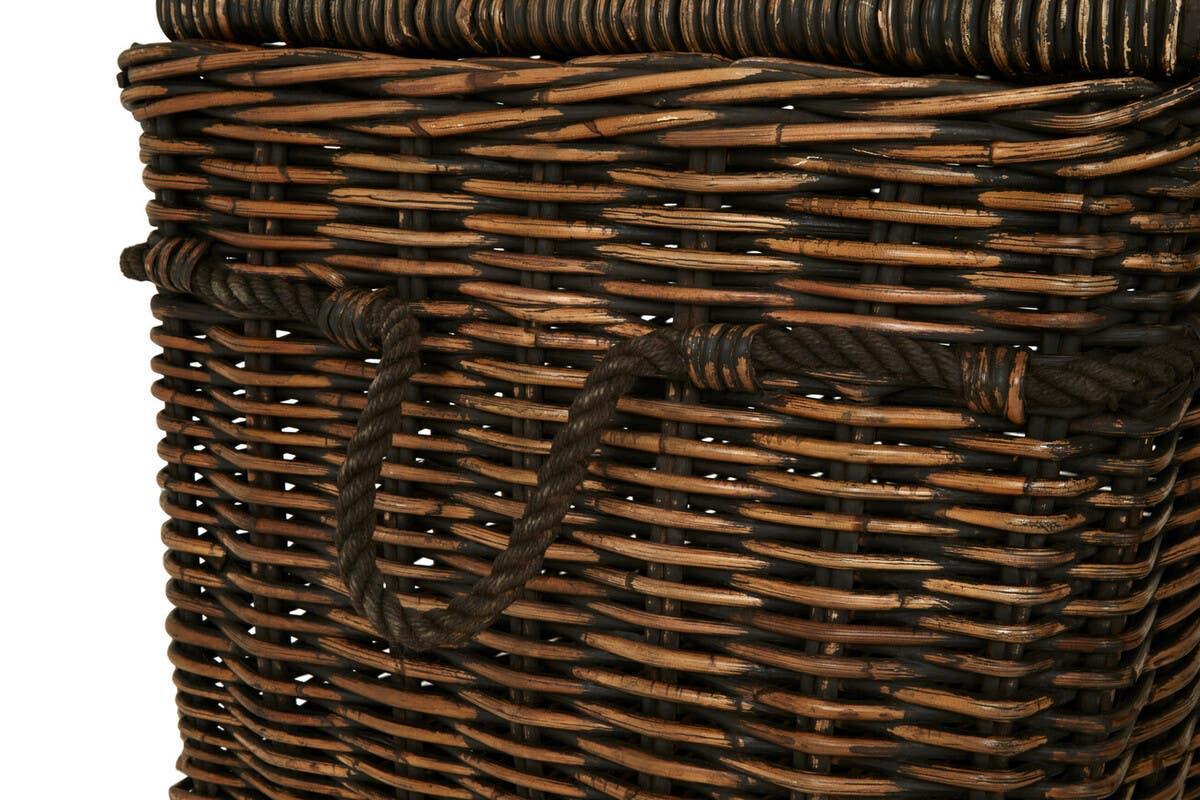 Brown wicker storage basket with rope handles, close-up of woven texture