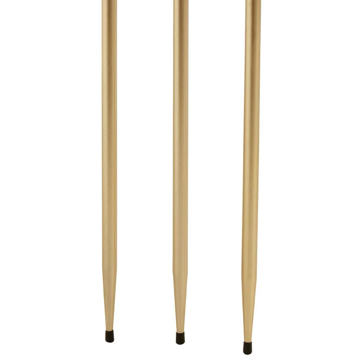 Gold metal table legs with black end caps, close-up view of three legs against white background
