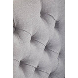 Grey upholstered headboard tufted fabric detail close up