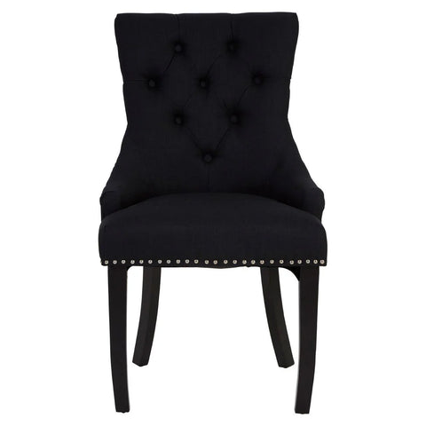 Black upholstered dining chair with tufted back and silver stud detailing, front view
