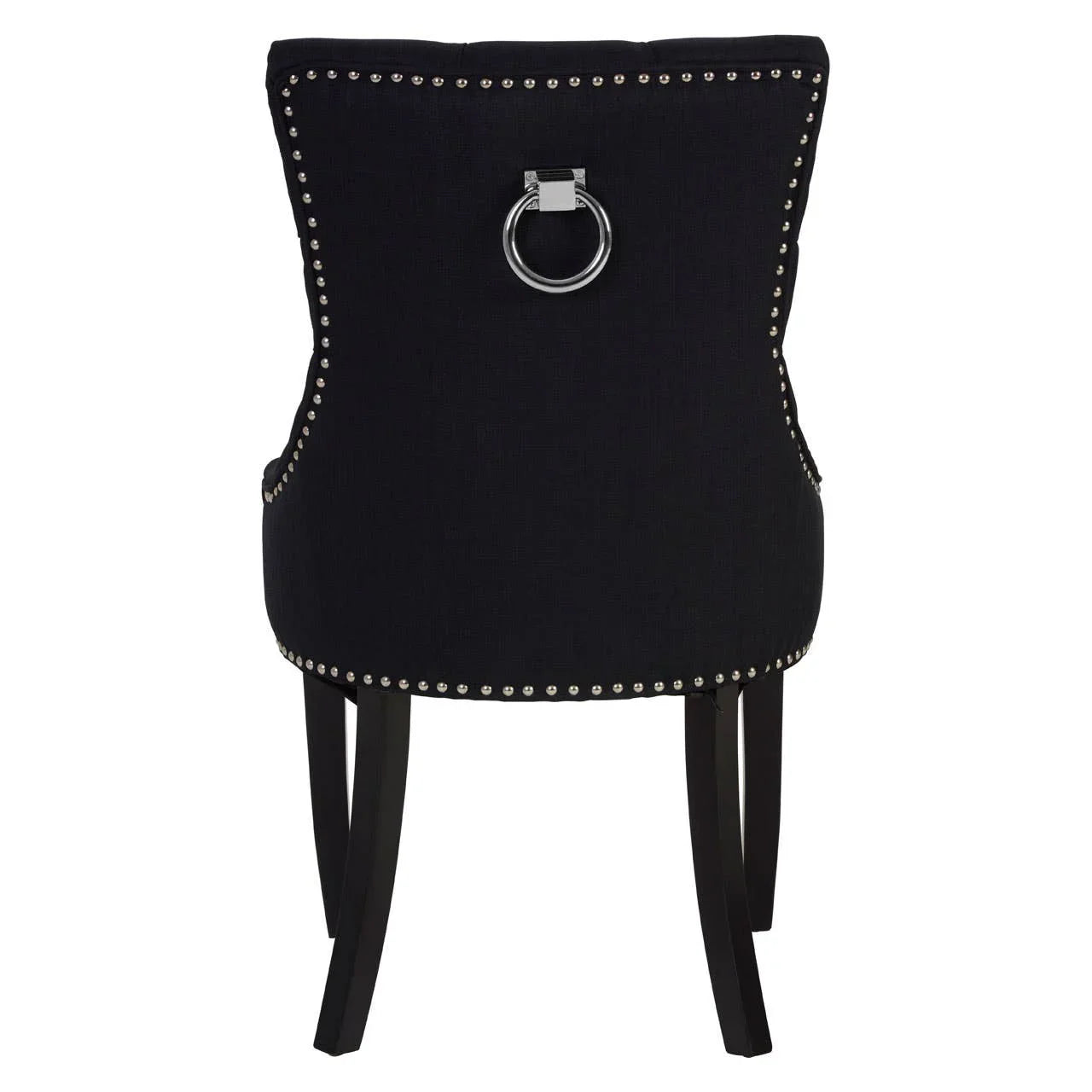 Black dining chair with chrome ring handle, silver stud trim, and dark wooden legs, rear view