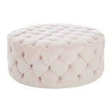 Round tufted ottoman upholstered in light pink velvet fabric