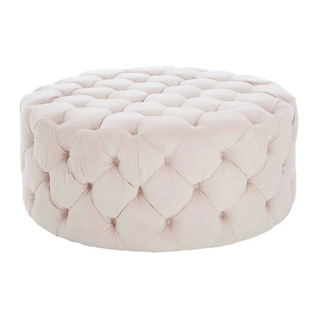 Round tufted ottoman upholstered in light pink velvet fabric