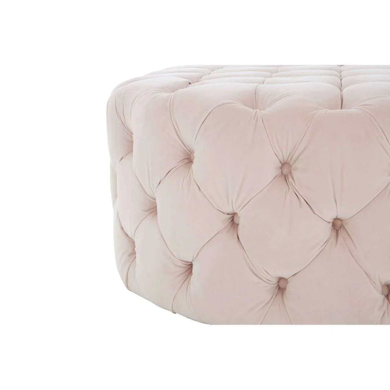 Cream velvet ottoman with deep button tufting, close-up of upholstered corner detail